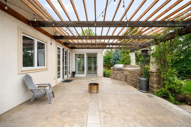 a view of a chair and table in the garden