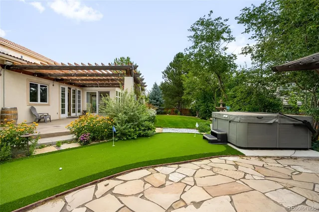 a view of a house with a backyard