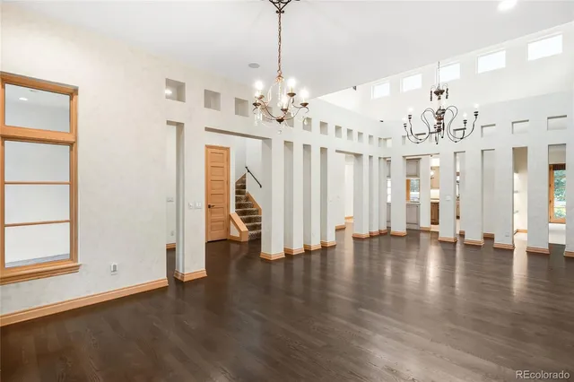 a kitchen with kitchen island granite countertop a sink stove and refrigerator