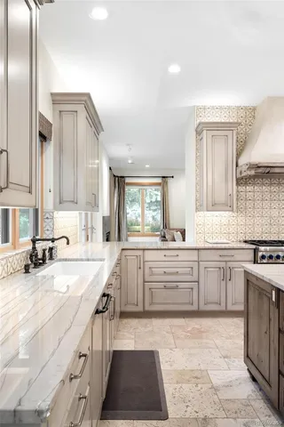 a kitchen with a stove and a sink