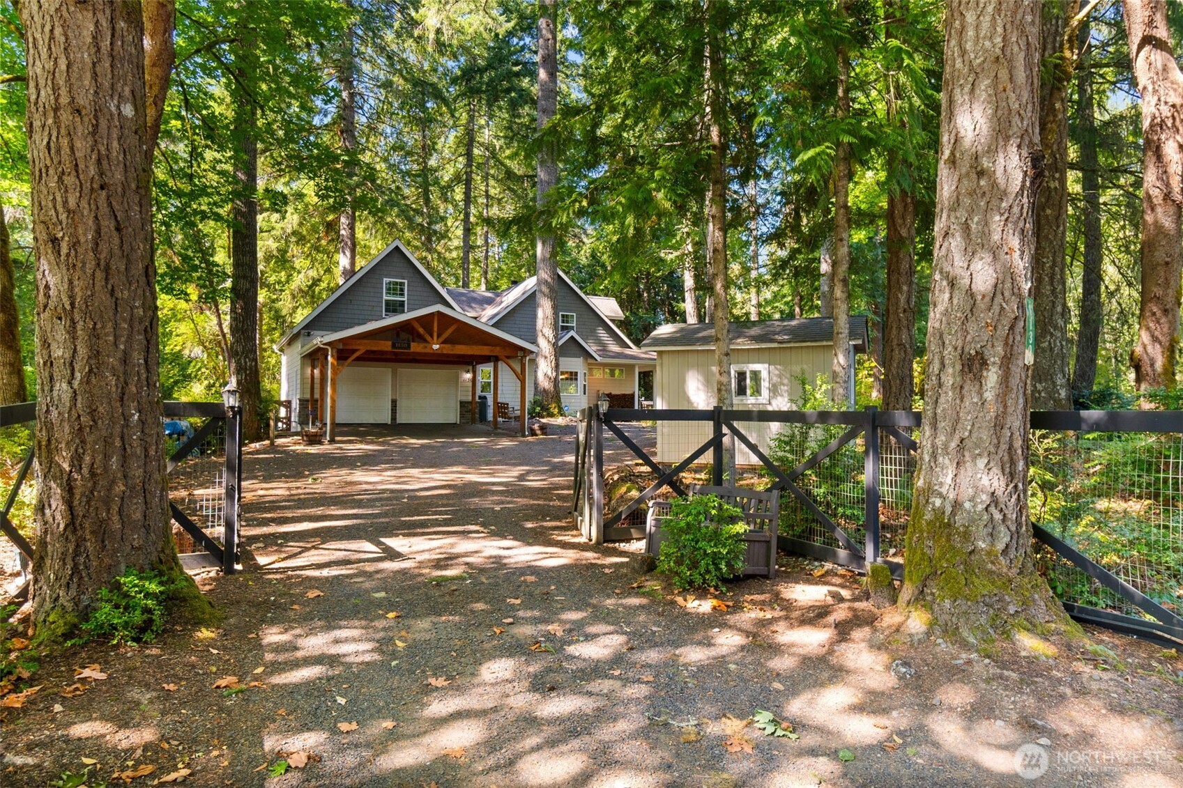 1130 East Sunset Hill Road Shelton, WA 98584 - Photo 5 of 40 a front view of a house with garden