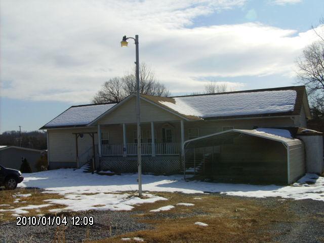 1410 Eton Road Hardy, VA 24101 - Photo 1 of 5 a front view of a house with a garden