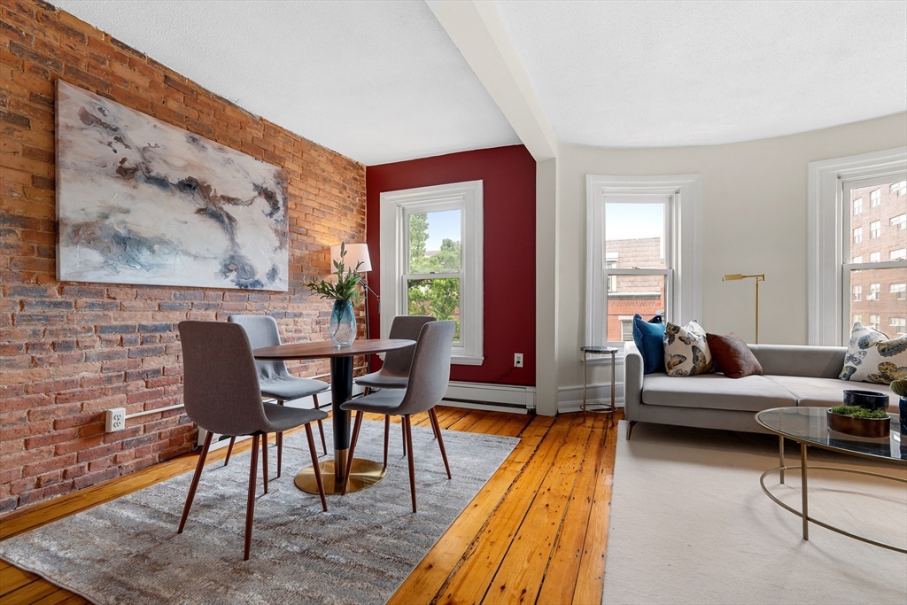 88 West Springfield Street, Unit 3 Boston, MA 02118 - Photo 4 of 17 a living room with furniture and a wooden floor