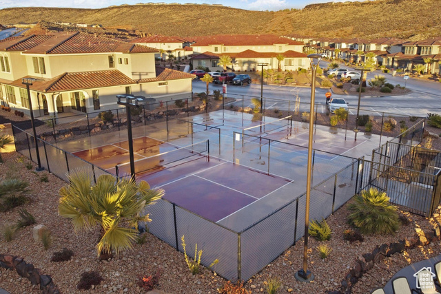 1329 Paseos Street Washington, UT 84780 - Photo 25 of 35 View of tennis court featuring a mountain view, a residential view, and a patio area