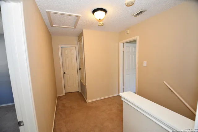 a view of a hallway with front door