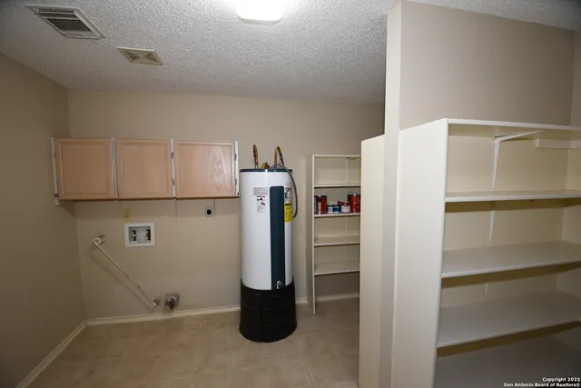 a refrigerator freezer sitting in a kitchen