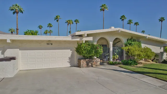 front view of a house with a potted plant