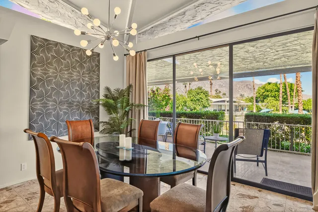 a view of a dining room with furniture window and outside view