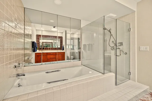 a bathroom with a shower and a sink