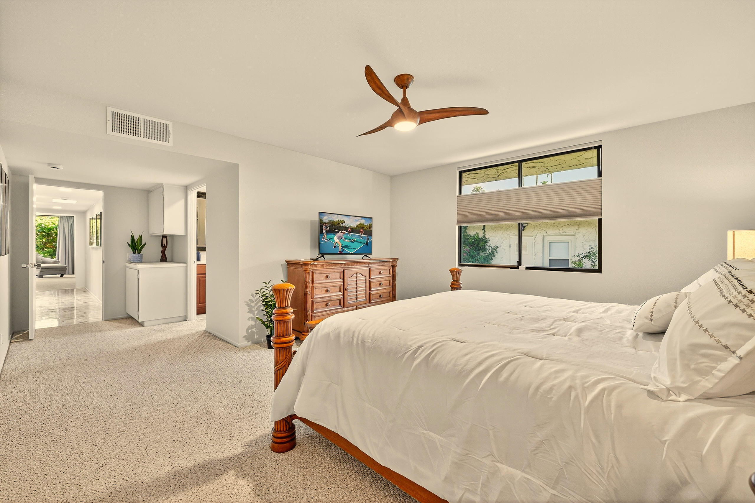 1570 South La Verne Way Palm Springs, CA 92264 - Photo 20 of 27 a bedroom with a bed and a large mirror