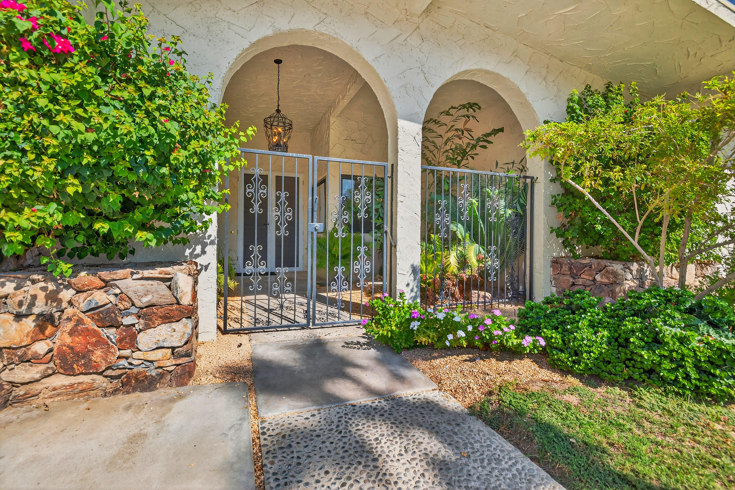 1570 South La Verne Way Palm Springs, CA 92264 - Photo 2 of 27 a front view of a house with garden