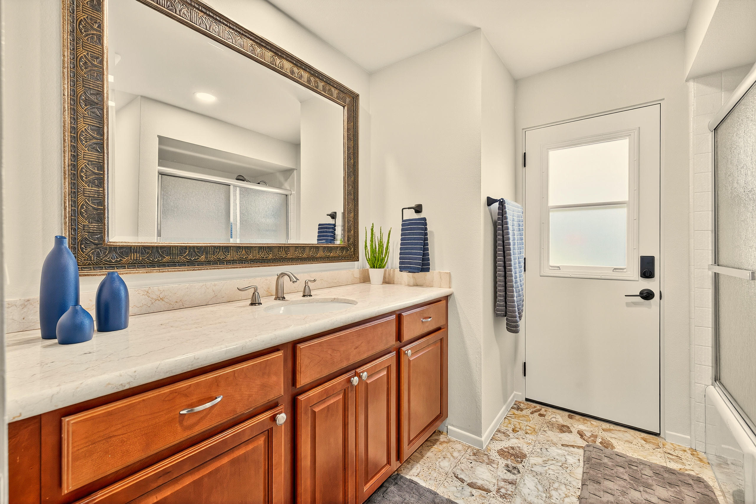 1570 South La Verne Way Palm Springs, CA 92264 - Photo 22 of 27 a bathroom with a sink and a mirror