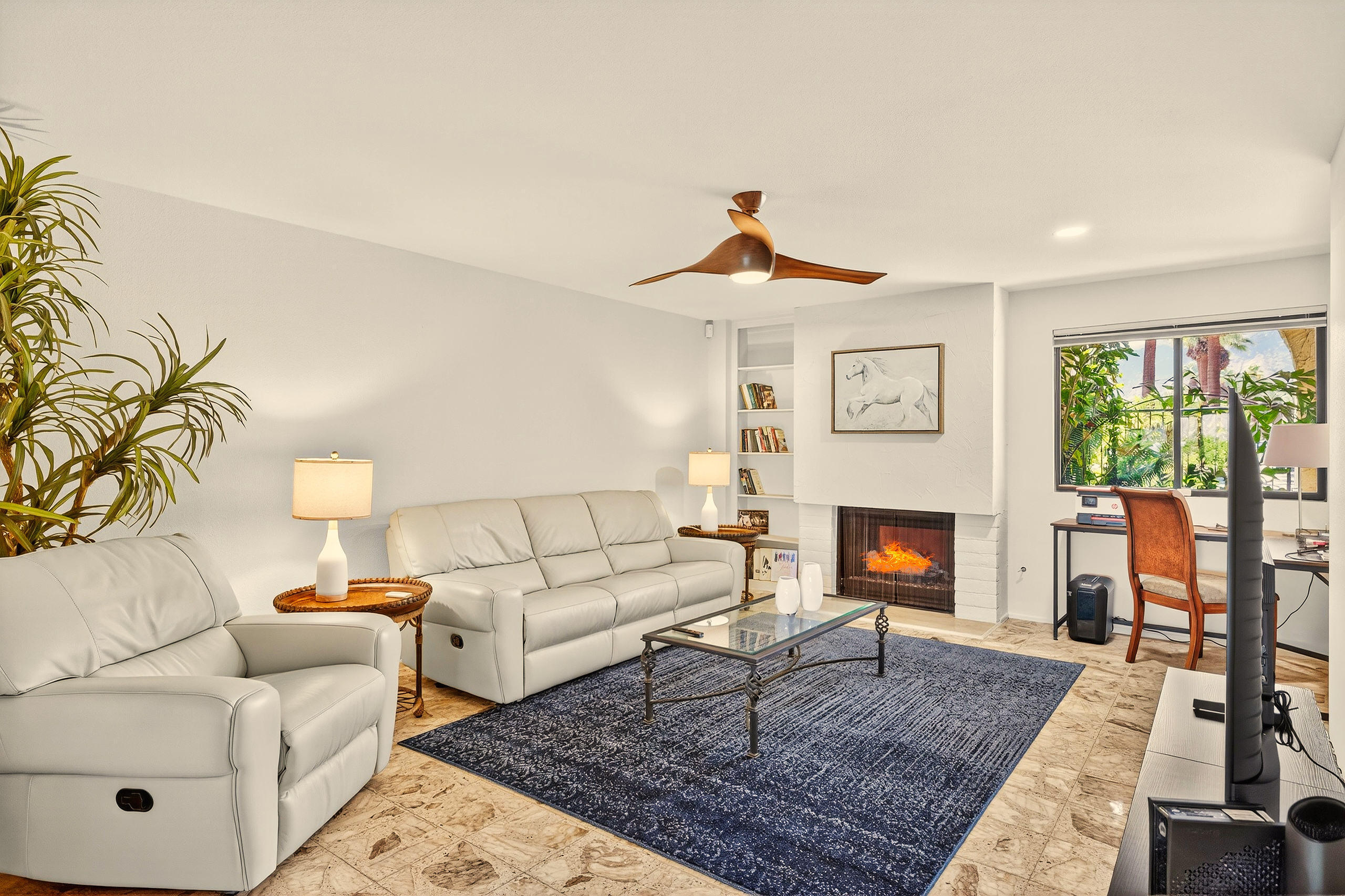 1570 South La Verne Way Palm Springs, CA 92264 - Photo 24 of 27 a living room with furniture and a fireplace