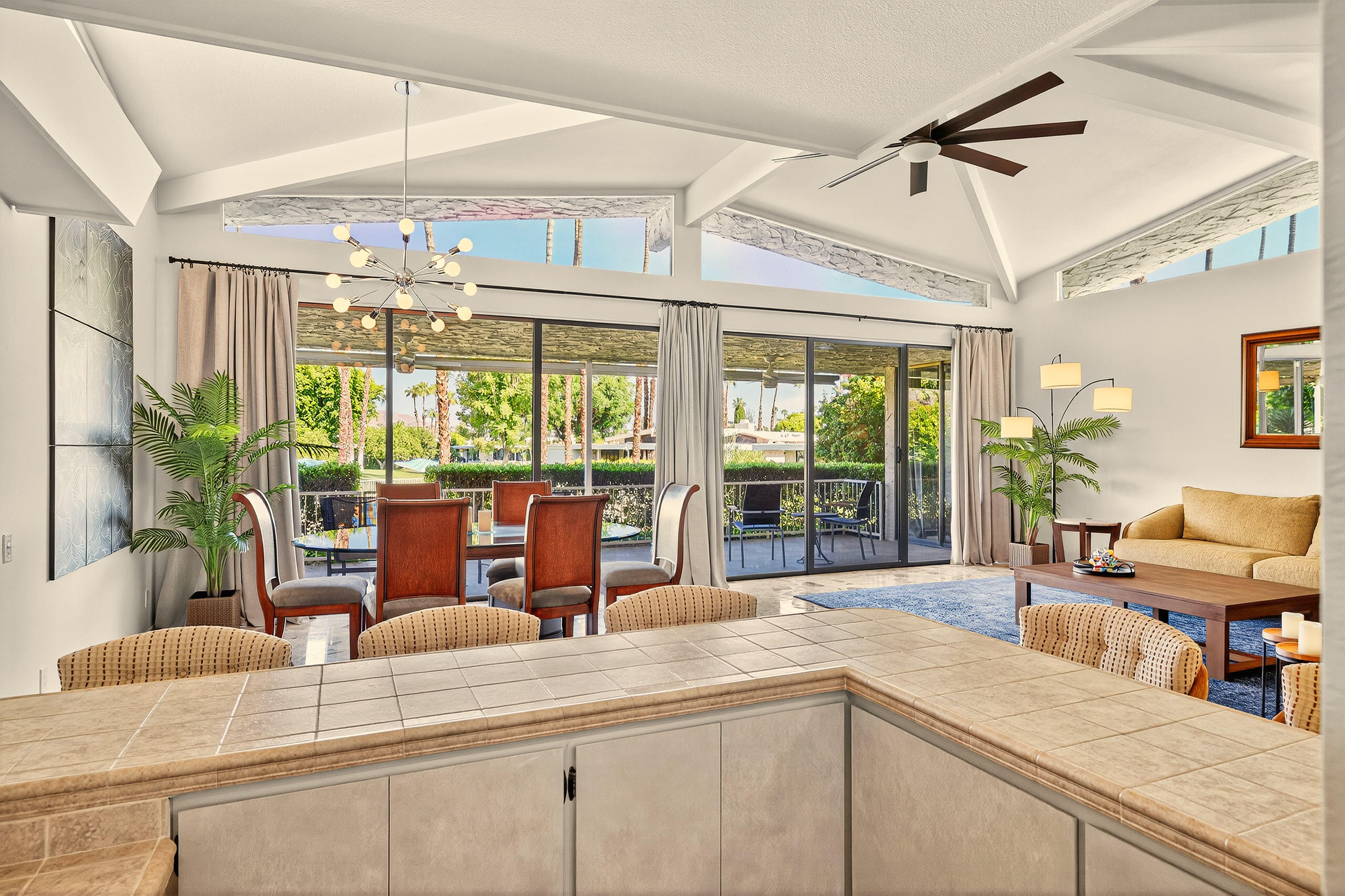 1570 South La Verne Way Palm Springs, CA 92264 - Photo 25 of 27 a kitchen with a large window and cabinets
