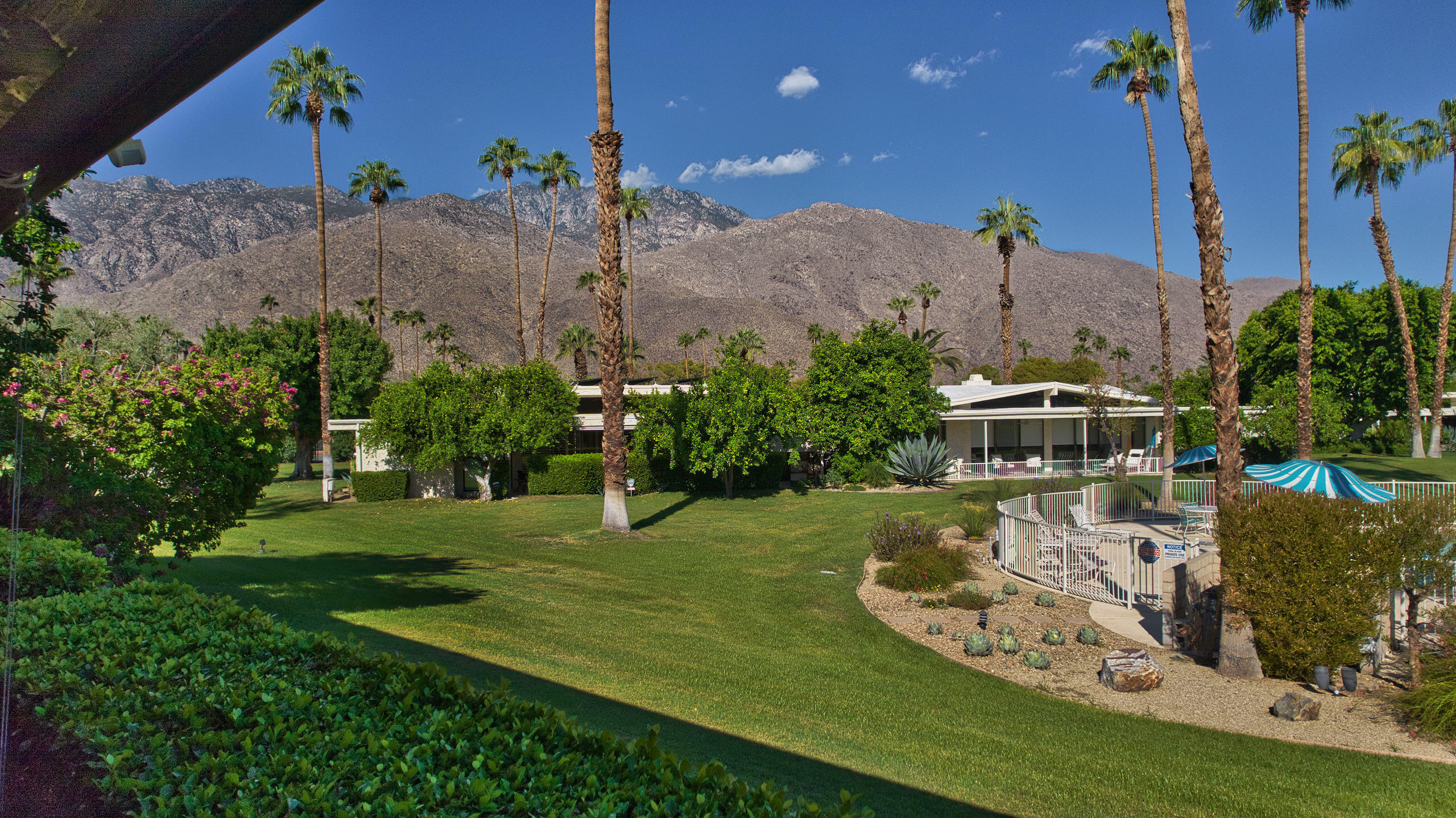 1570 South La Verne Way Palm Springs, CA 92264 - Photo 27 of 27 a view of a swimming pool with a yard
