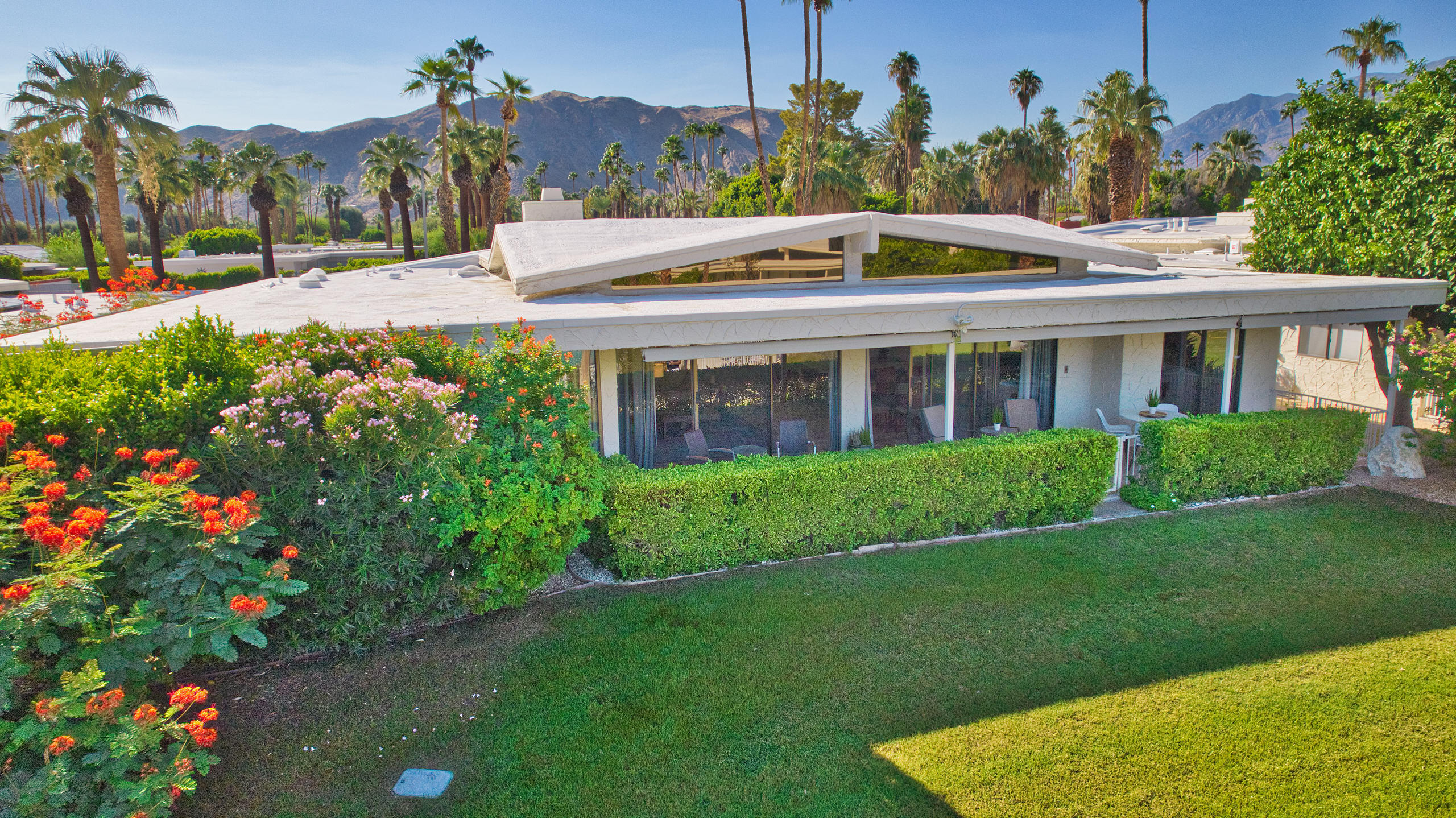 1570 South La Verne Way Palm Springs, CA 92264 - Photo 5 of 27 a front view of a house with a yard