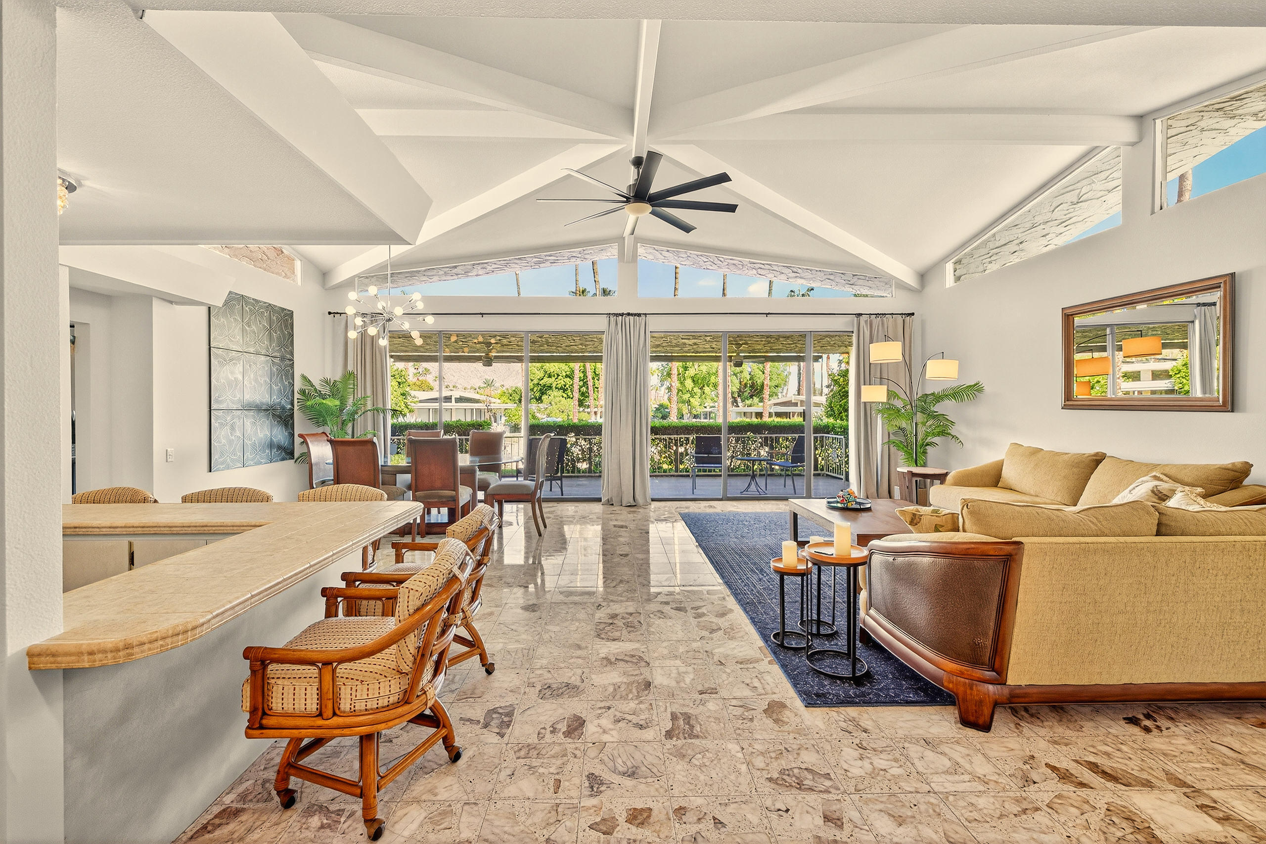 1570 South La Verne Way Palm Springs, CA 92264 - Photo 9 of 27 a living room with furniture a flat screen tv and a large window