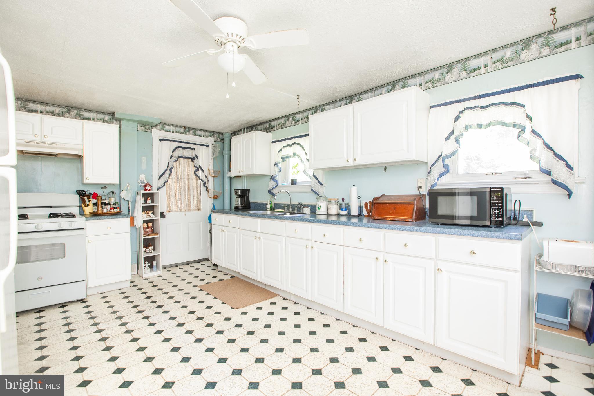 752 Groveville Road Hamilton, NJ 08620 - Photo 11 of 33 a kitchen with a sink cabinets and window