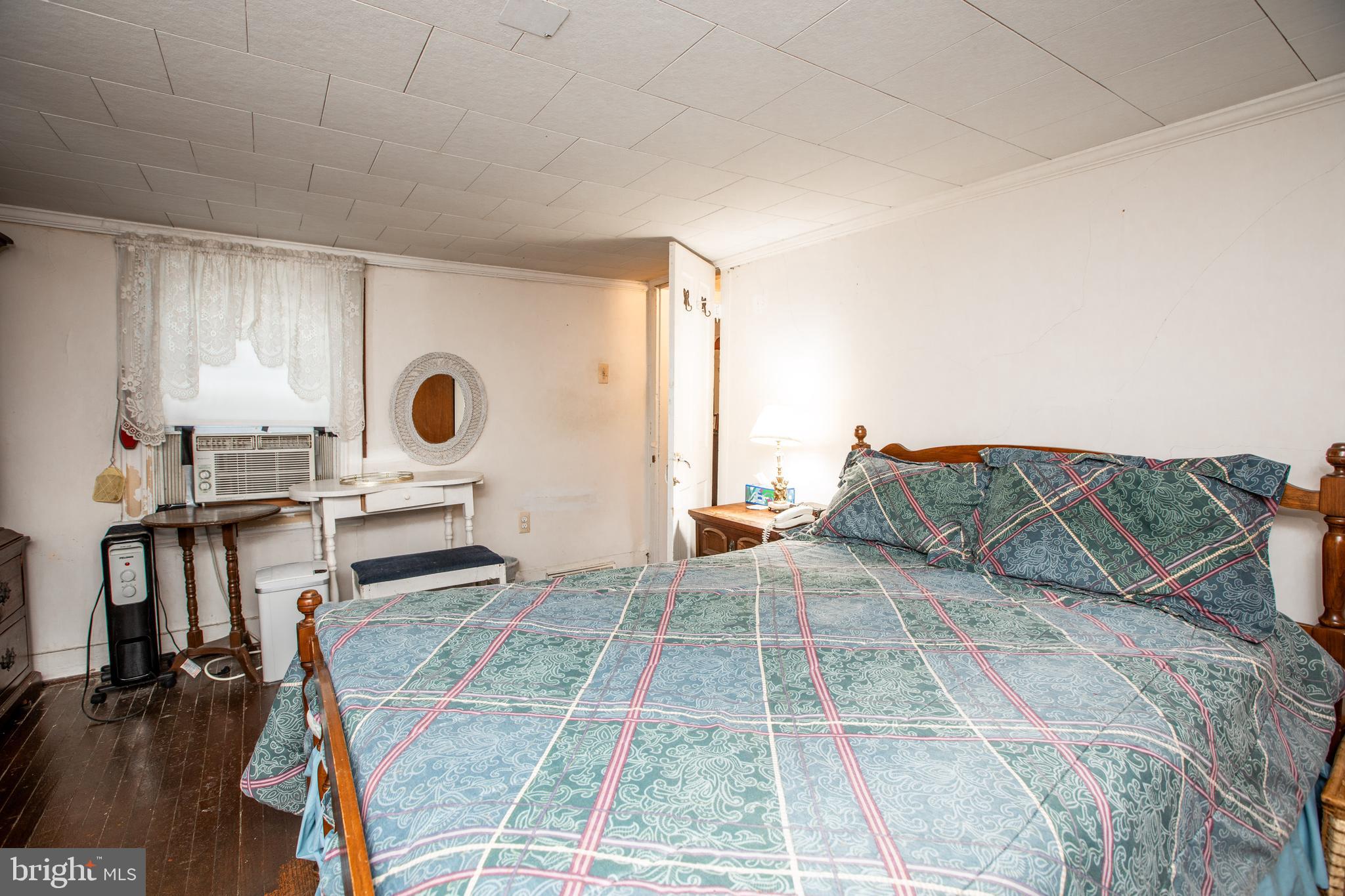 752 Groveville Road Hamilton, NJ 08620 - Photo 19 of 33 a bed room with a bed and a chair