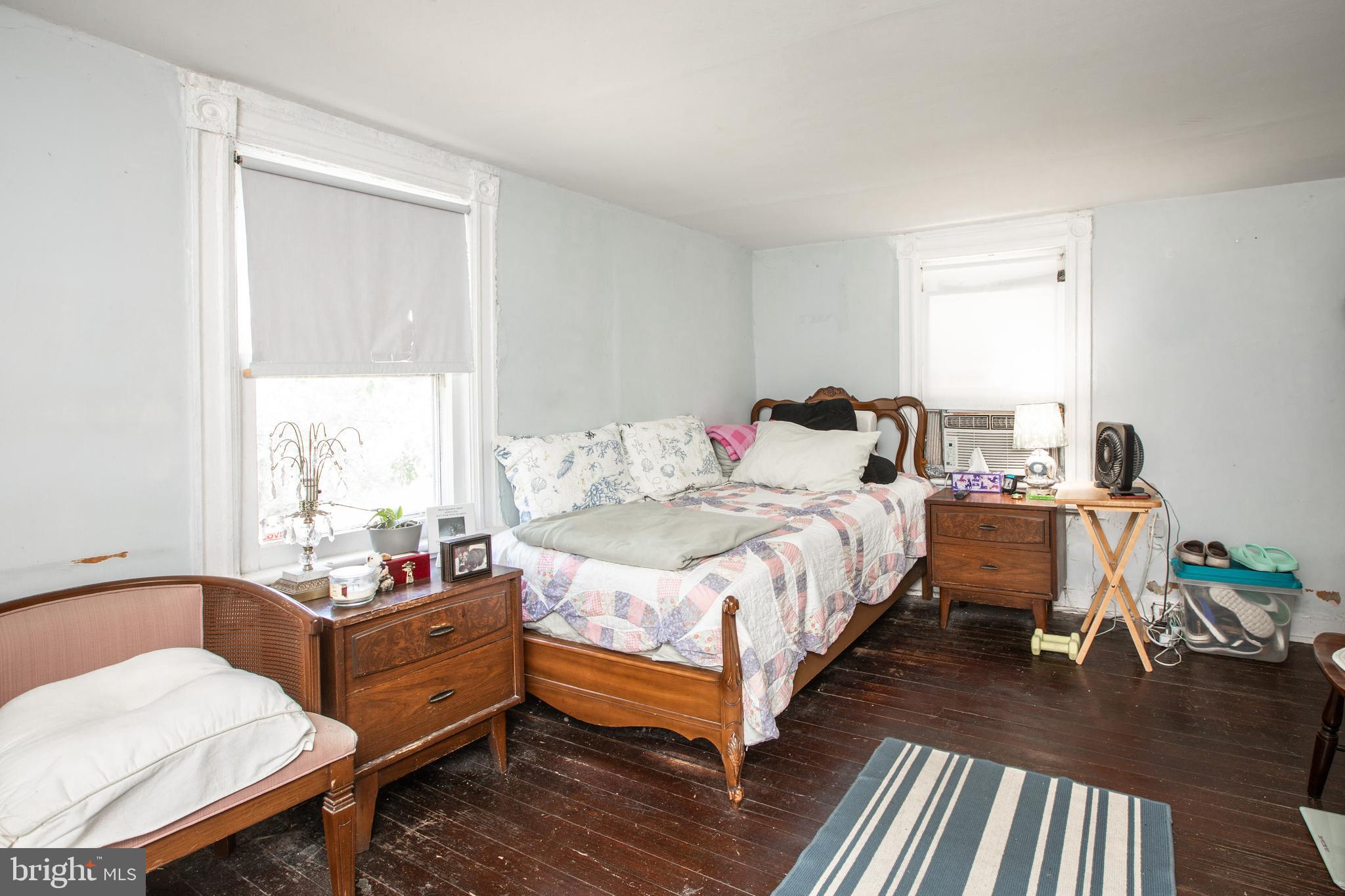 752 Groveville Road Hamilton, NJ 08620 - Photo 20 of 33 a bedroom with a bed and wooden floor