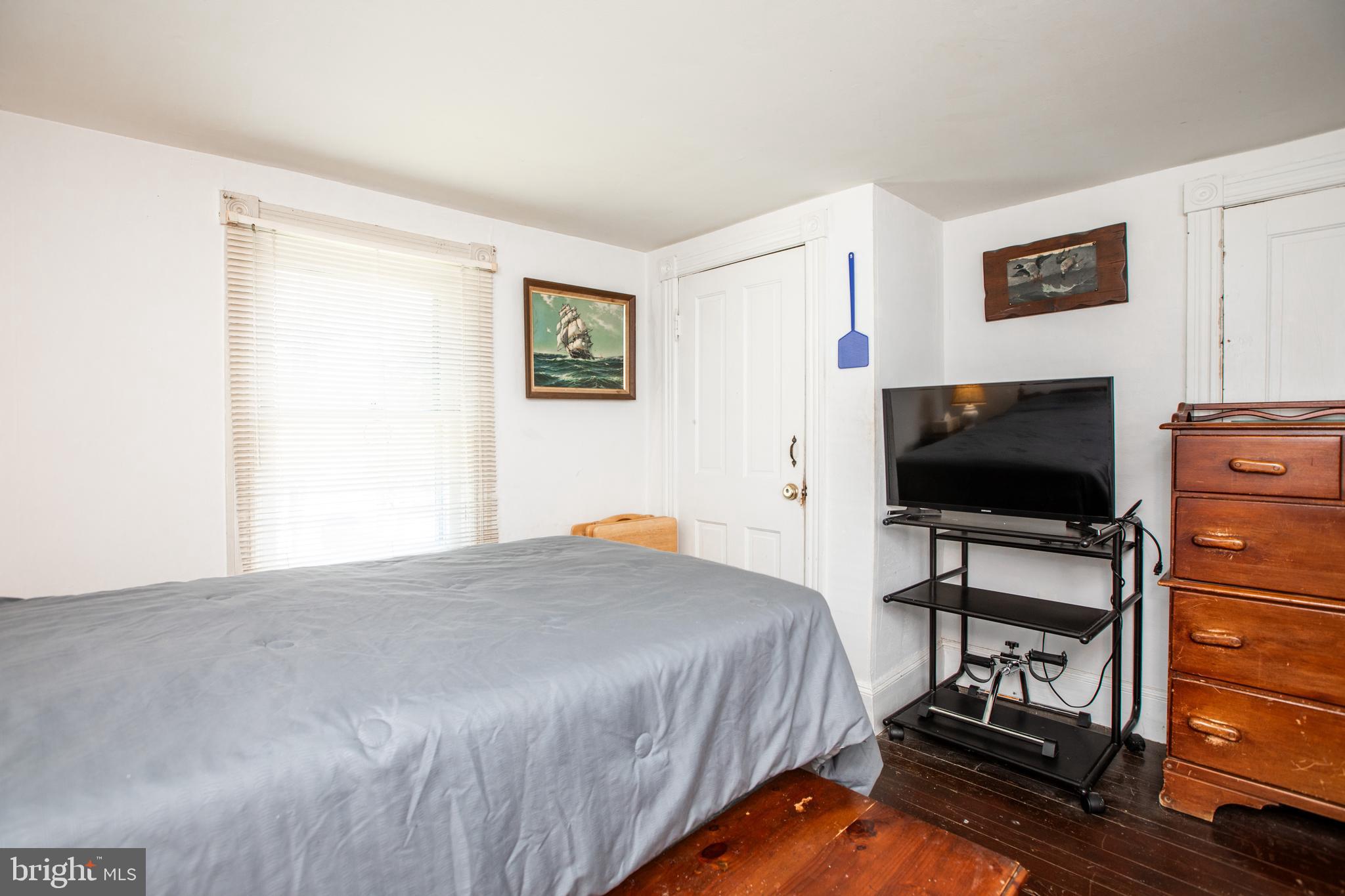 752 Groveville Road Hamilton, NJ 08620 - Photo 24 of 33 a bedroom with a bed and a flat screen tv