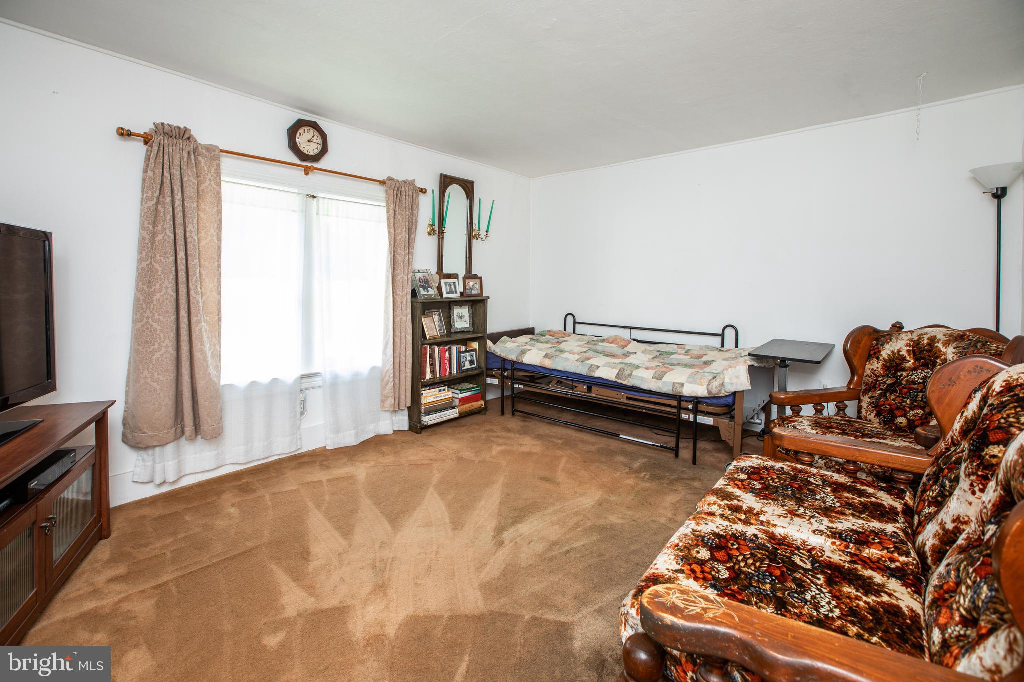 752 Groveville Road Hamilton, NJ 08620 - Photo 5 of 33 a living room with furniture and a flat screen tv