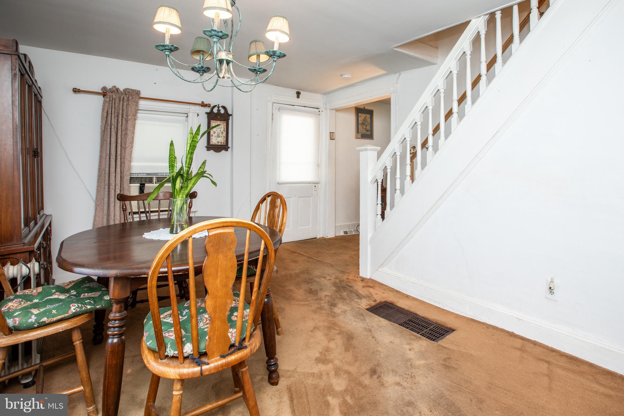 752 Groveville Road Hamilton, NJ 08620 - Photo 7 of 33 a dining room with furniture a livingroom and chandelier