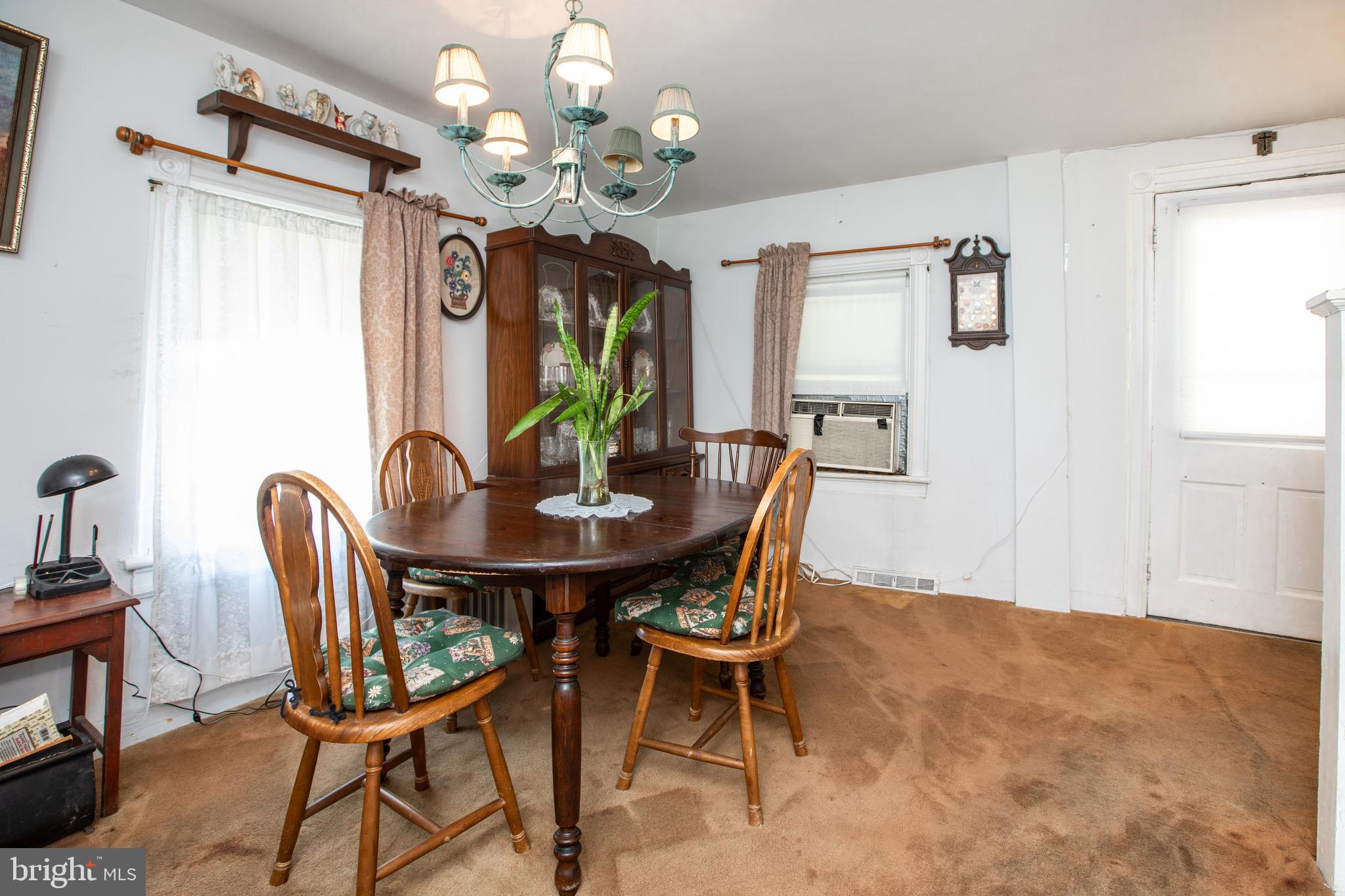 752 Groveville Road Hamilton, NJ 08620 - Photo 8 of 33 a view of a dining room with furniture and a chandelier