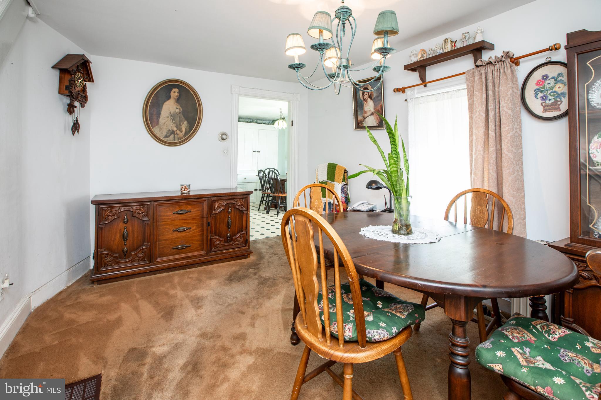 752 Groveville Road Hamilton, NJ 08620 - Photo 9 of 33 a view of a dining room with furniture and a chandelier