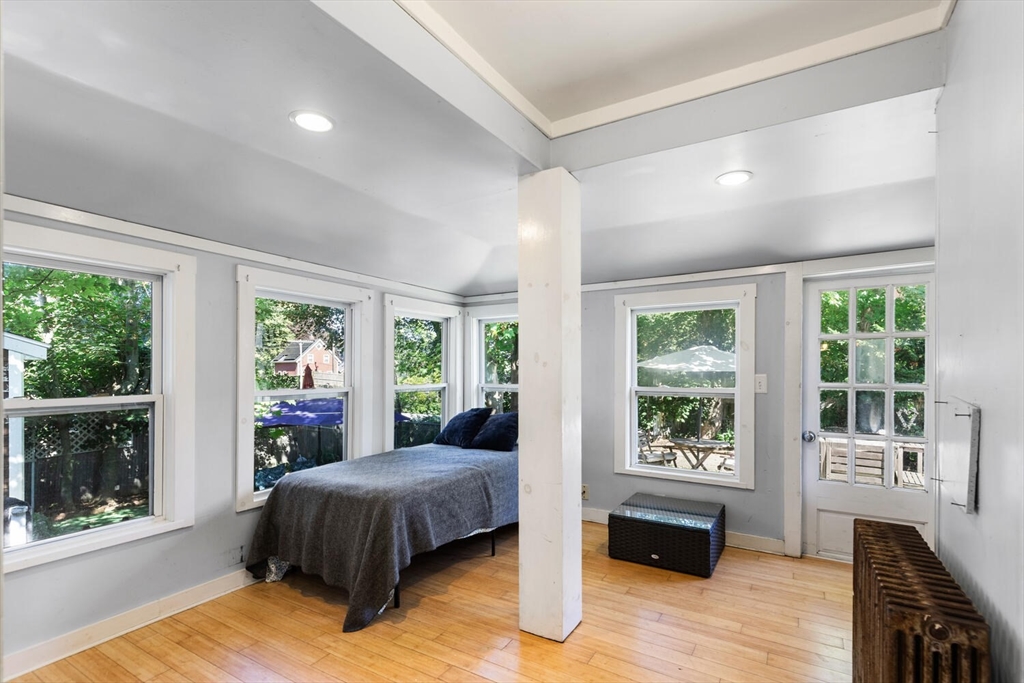 12 Harold Avenue Gloucester, MA 01930 - Photo 12 of 23 a spacious bedroom with a large bed and a large window