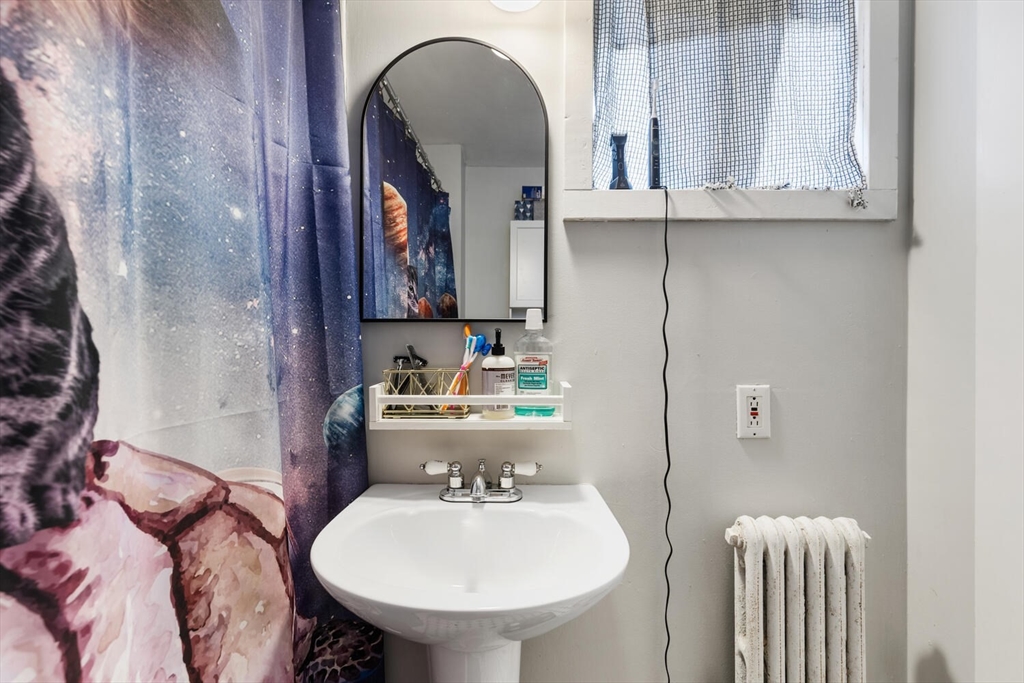 12 Harold Avenue Gloucester, MA 01930 - Photo 14 of 23 a bathroom with a sink toilet and mirror
