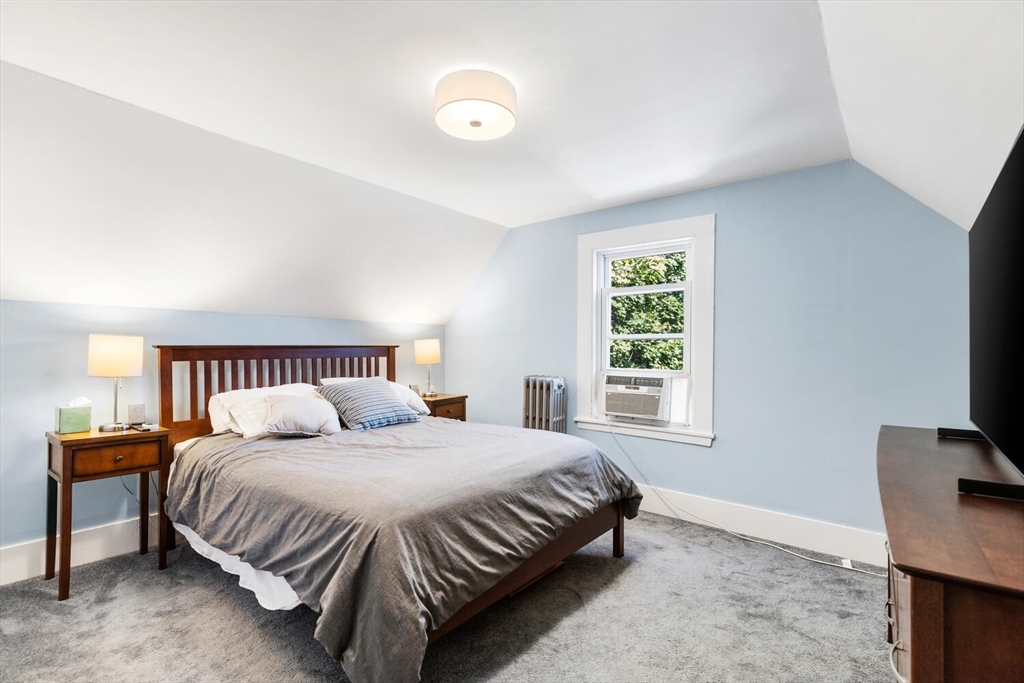 12 Harold Avenue Gloucester, MA 01930 - Photo 17 of 23 a bedroom with a bed and a flat screen tv