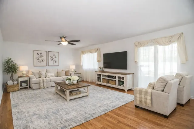 a living room with furniture and a flat screen tv