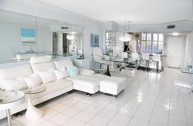 a bedroom with a large bed and a large window