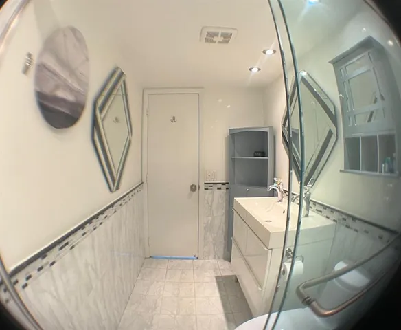 a bathroom with a shower and a sink