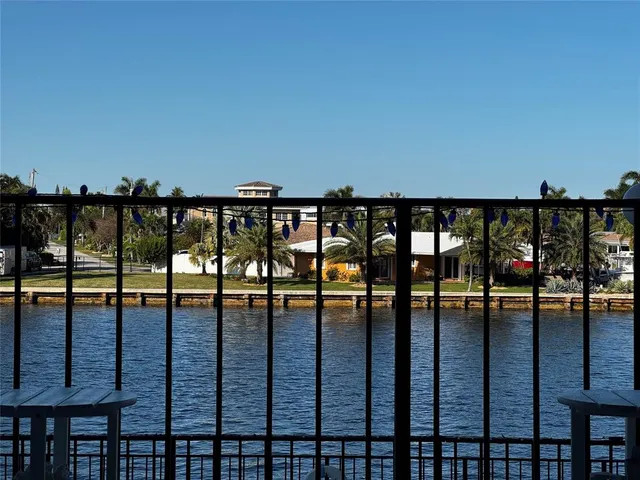 a view of a chairs and table in patio