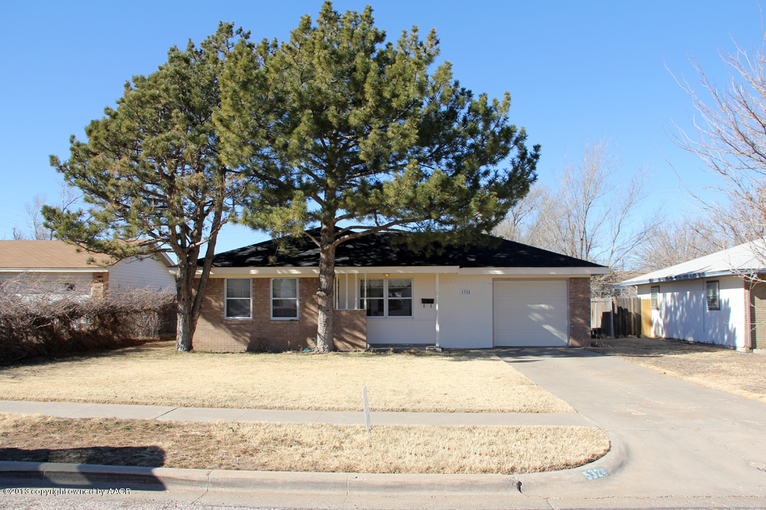 5324 Allen Street Amarillo, TX 79110 - Photo 2 of 24 a front view of a house with a yard