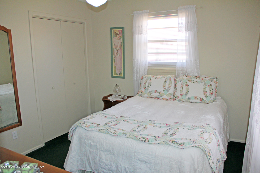 5324 Allen Street Amarillo, TX 79110 - Photo 11 of 24 a bedroom with a bed and a window