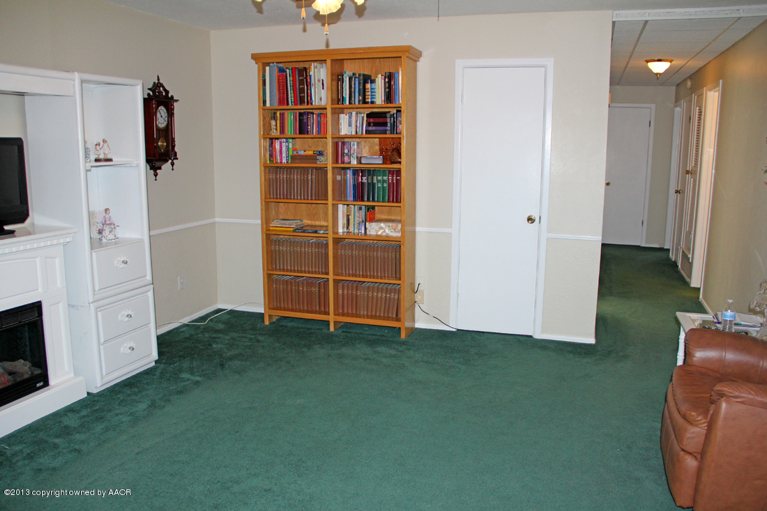 5324 Allen Street Amarillo, TX 79110 - Photo 4 of 24 a living room with furniture and a flat screen tv