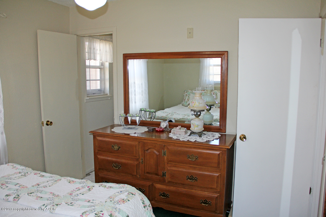 5324 Allen Street Amarillo, TX 79110 - Photo 10 of 24 a room with a dresser and mirror