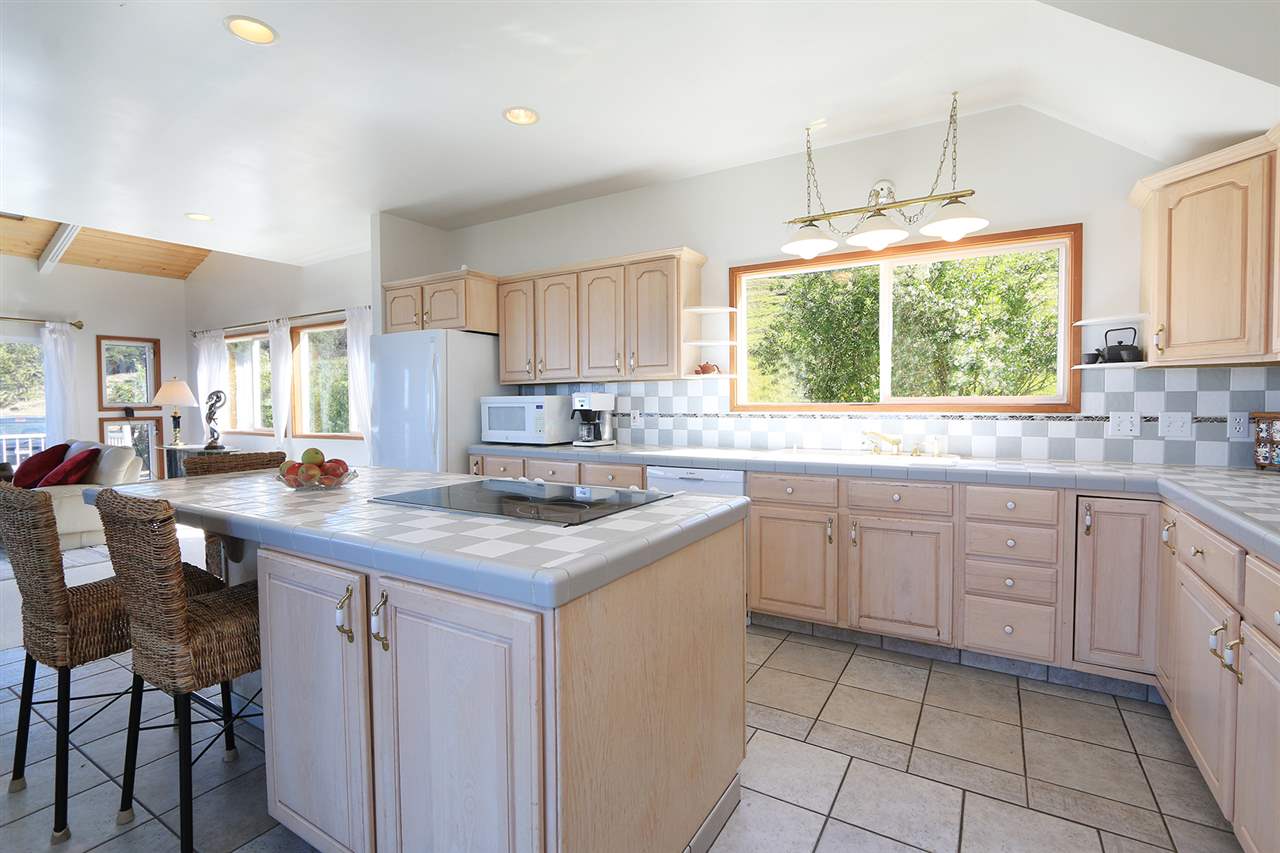 1415 Middle Road Kula, HI 96790 - Photo 19 of 30 a kitchen with a sink window and cabinets