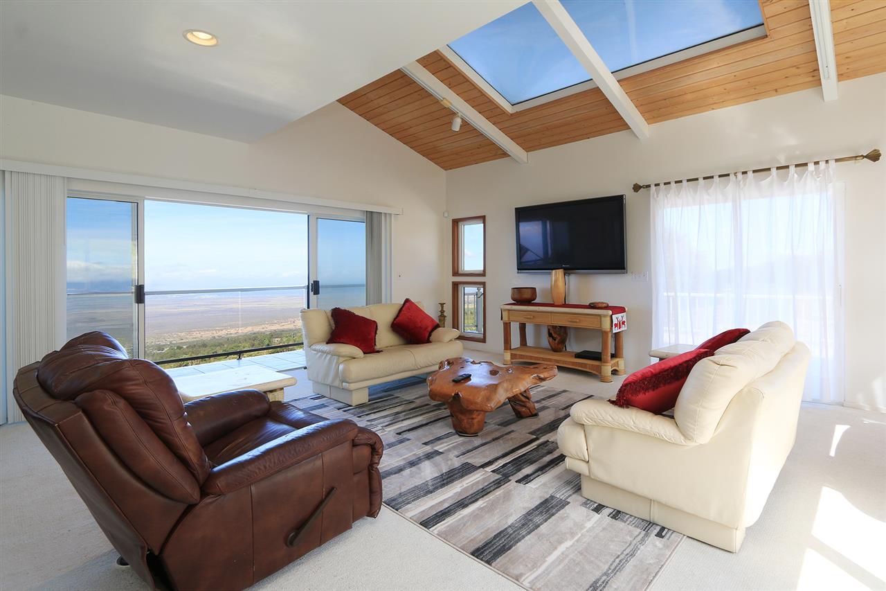 1415 Middle Road Kula, HI 96790 - Photo 4 of 30 a living room with furniture a flat screen tv and kitchen view