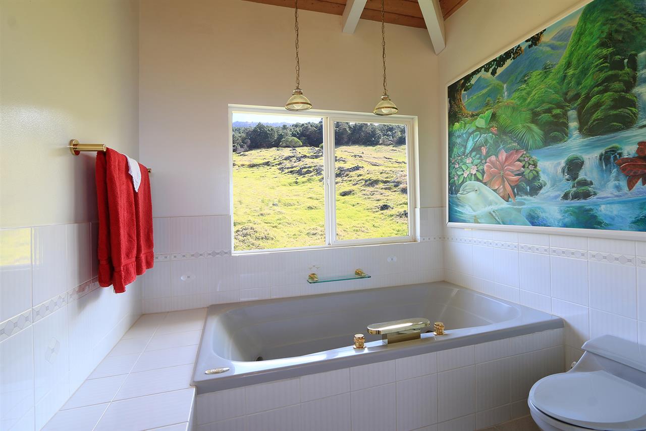 1415 Middle Road Kula, HI 96790 - Photo 9 of 30 a bathroom with a bathtub and a shower