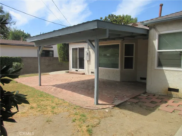 a view of a house with a snow in the yard