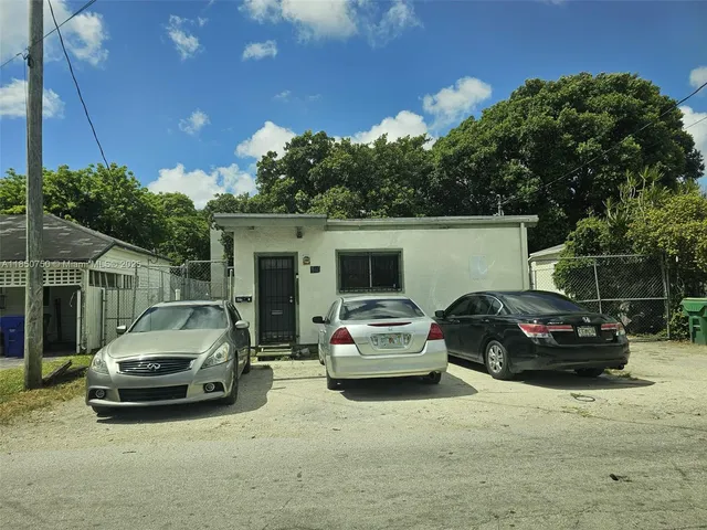 a view of car parked in front of a house