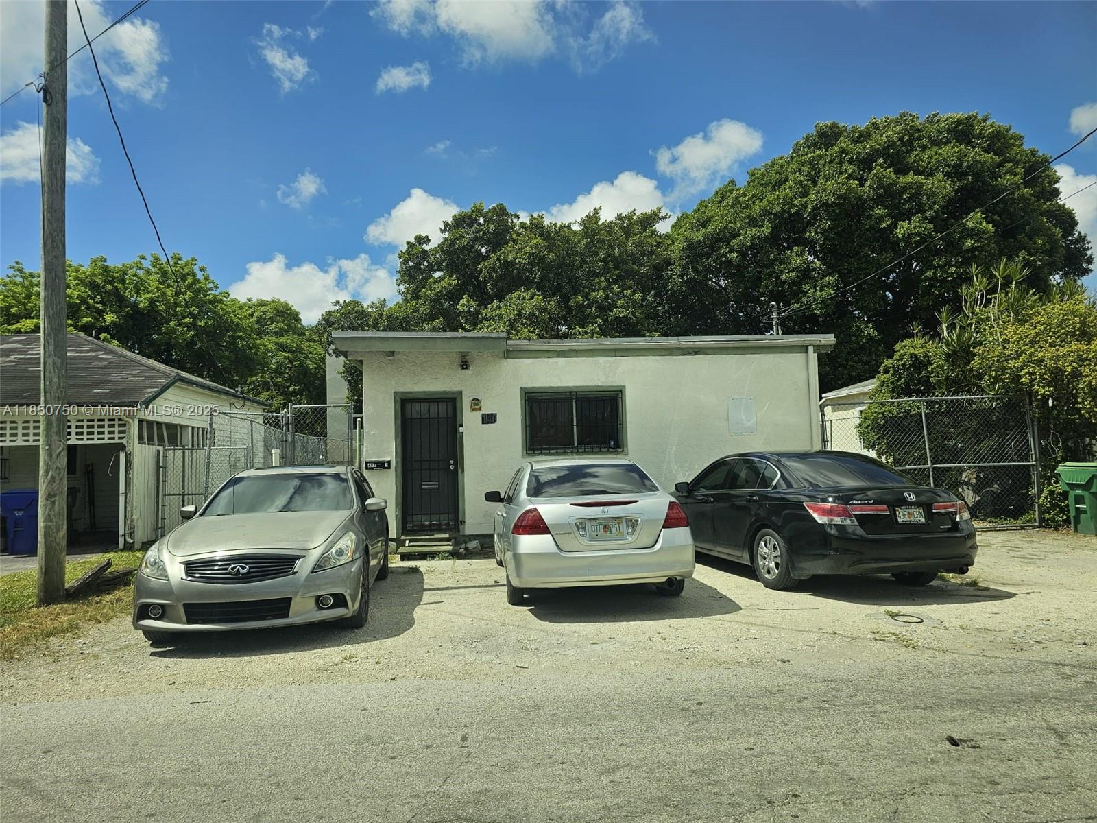 140 Northeast 83rd Street Miami, FL 33138 - Photo 2 of 4 a view of car parked in front of a house
