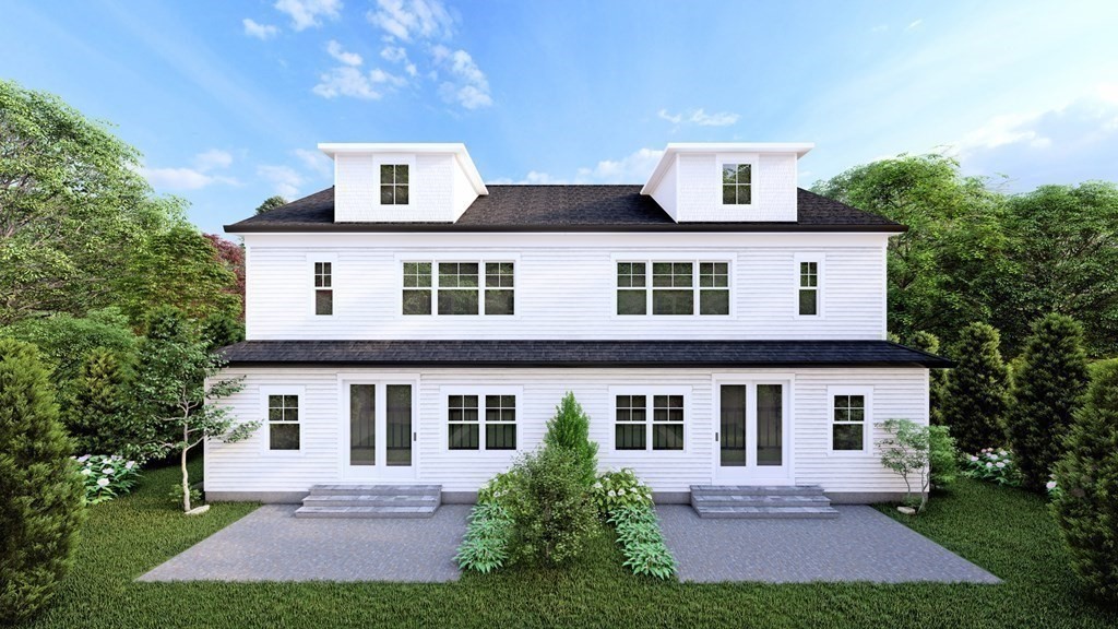 51 Louise Road, Unit 51 Newton, MA 02467 - Photo 5 of 9 a front view of a house with yard