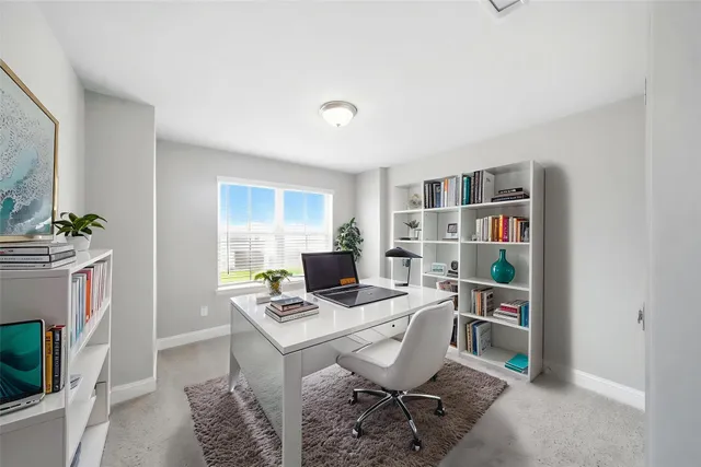 a workspace with furniture and a book shelf