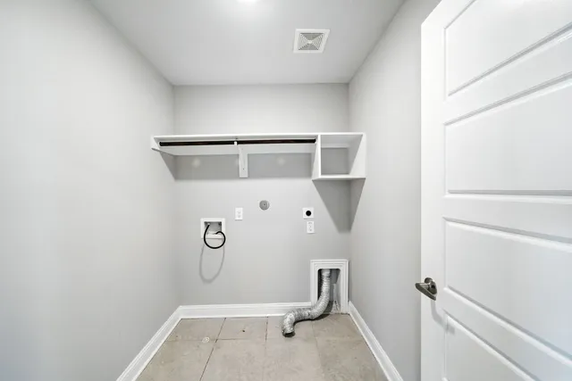 a bathroom with a window and mirror