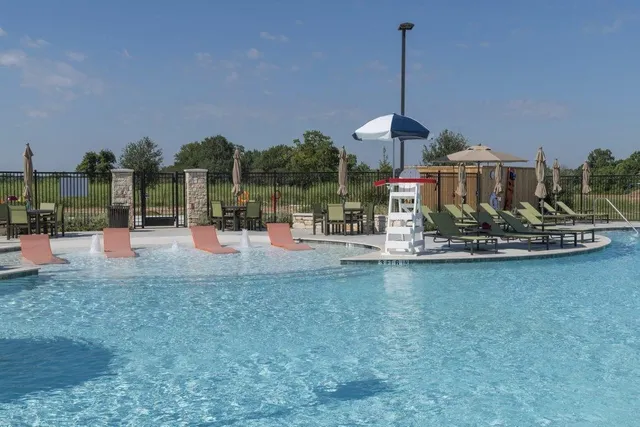 a table and chairs sitting in the middle of a yard
